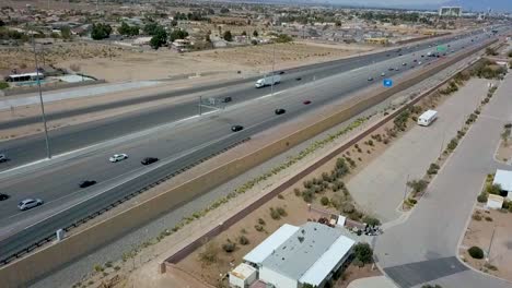 Aerial-flyby-next-to-Sunday-afternoon-traffic-on-busy-Interstate-Highway