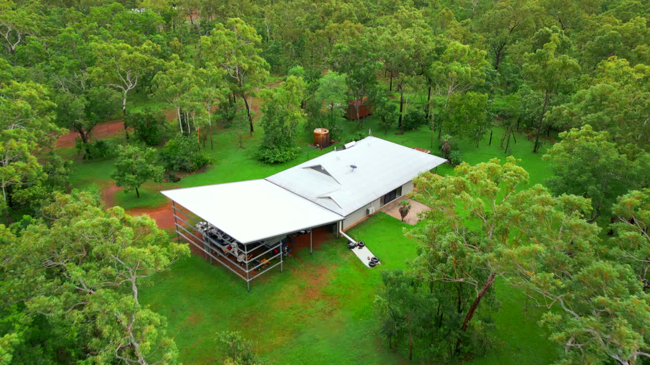 Aerial drone of Rural Estate Outback Block with House and Slanted Roof Covering Darwin Northern Territory Australia