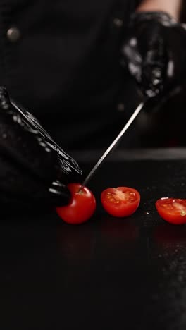 chef cutting cherry tomatoes