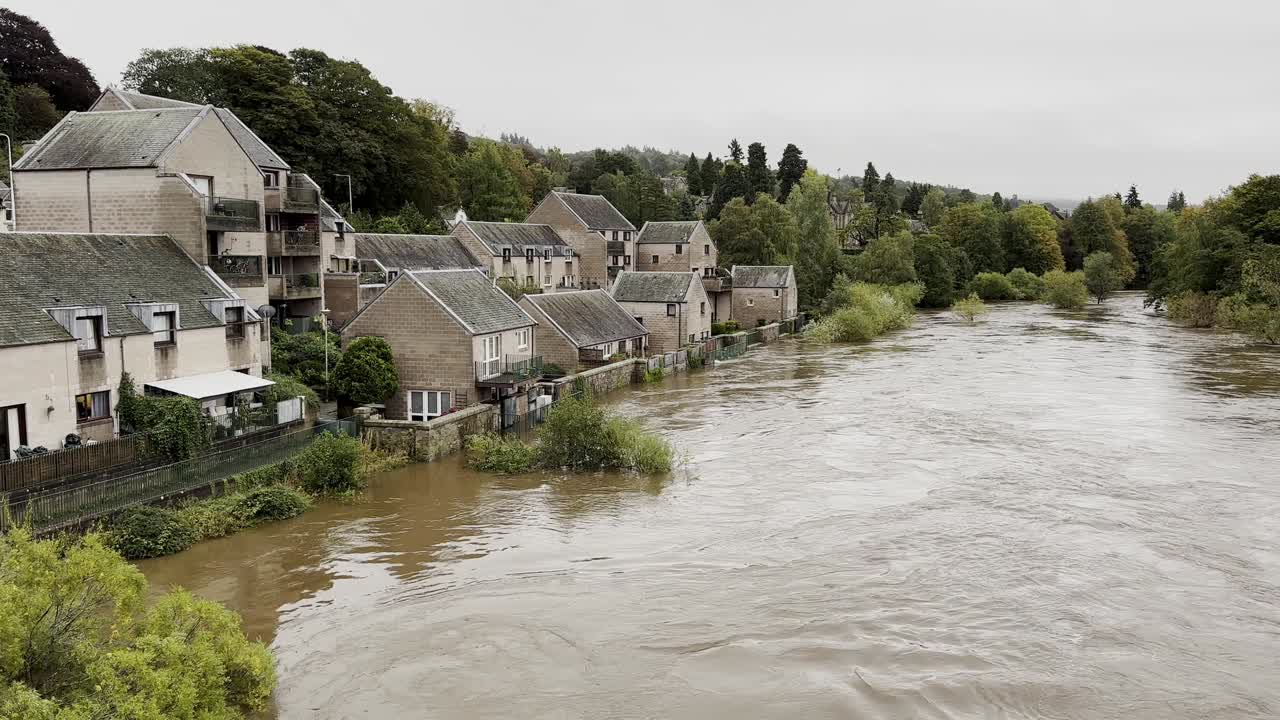 Static shot of buildings being flooded by River Tay on 8