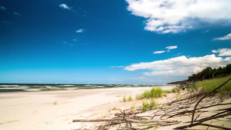 beach timelapse blue sky and white clouds over sandy beach
