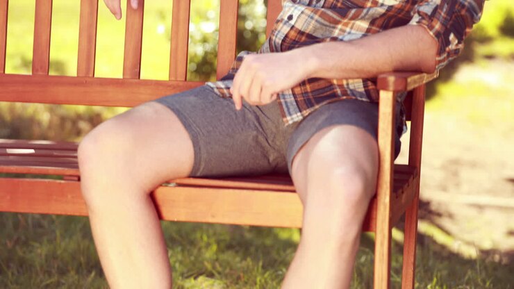 In high quality 4k format handsome hipster relaxing in the park