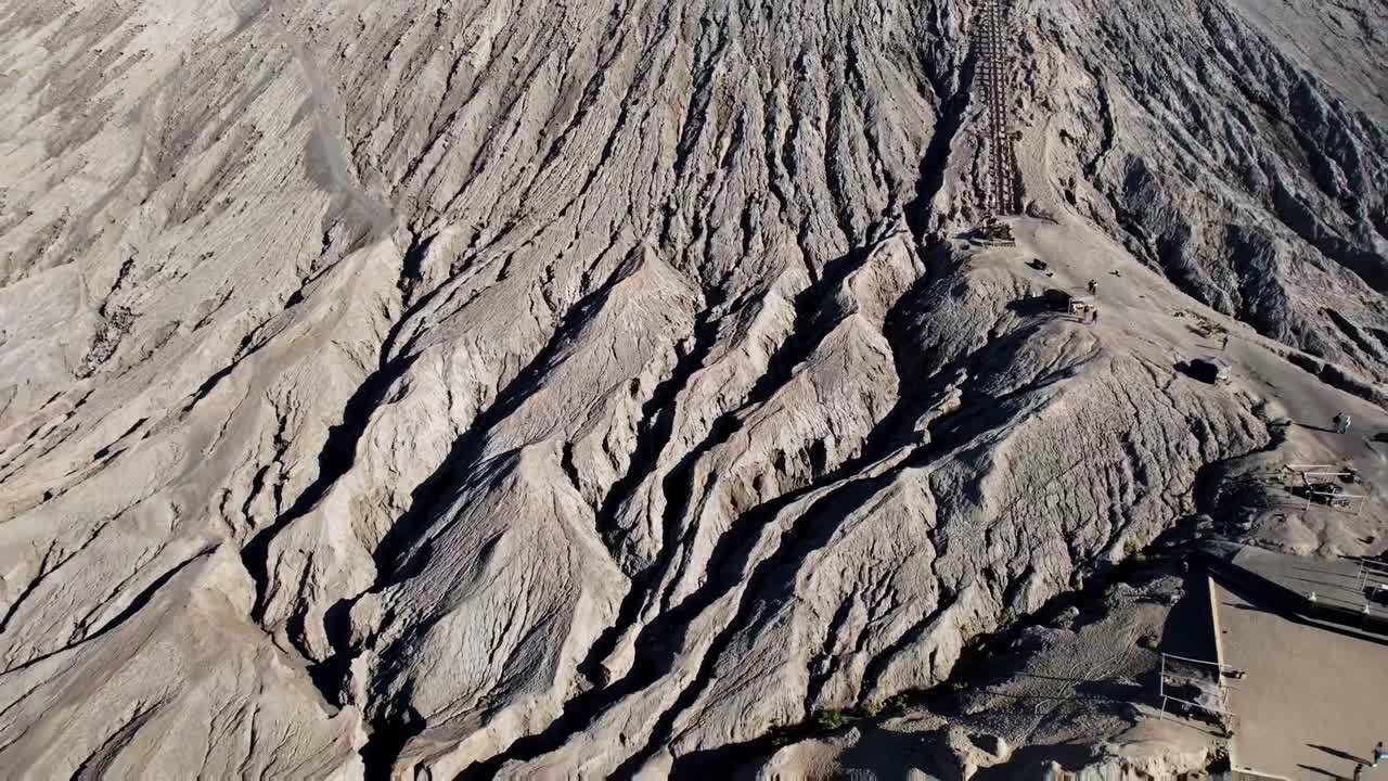Tourists climb the safe stairs to Mount Bromo crater in Java, Indonesia