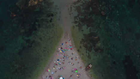 Triangle-shape-beach-surrounded-by-clear-sea