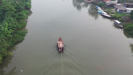 river boat transport in rural indonesia