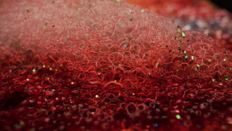 red glitter soap bubbles macro