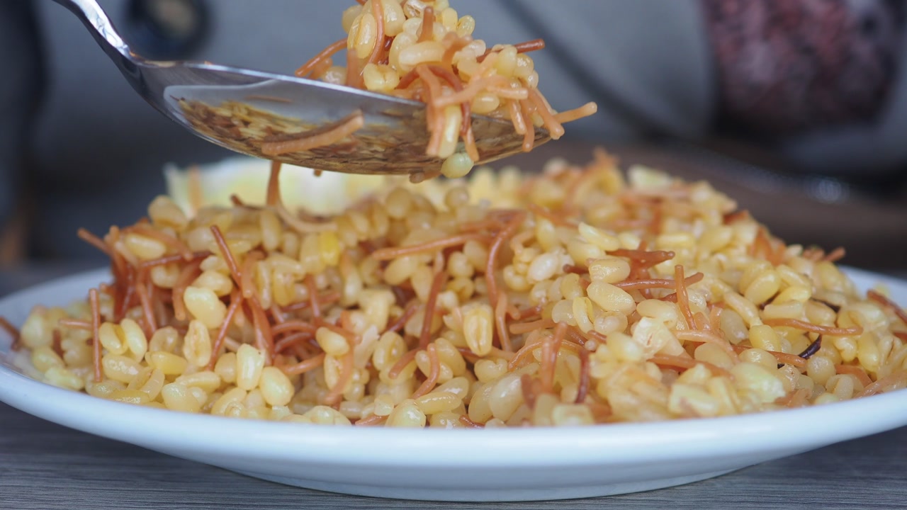 Close-up of Delicious Bulgur Pilaf with Vermicelli Being Served