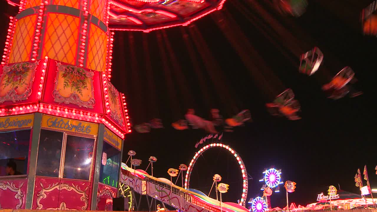 Swings at a carnival at night