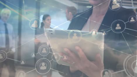 Network-of-profile-icons-caucasian-businesswoman-using-digital-tablet-against-clouds-in-the-sky