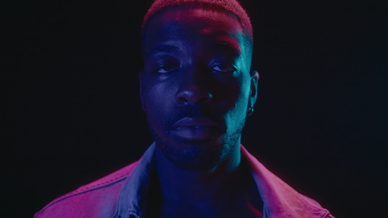 African-American Man Posing in Neon Lights