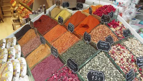 a variety of spices and herbs for sale at a turkish market.