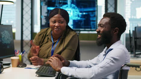 Cheerful Manager And Employee With Paraplegia In Inclusive Workplace