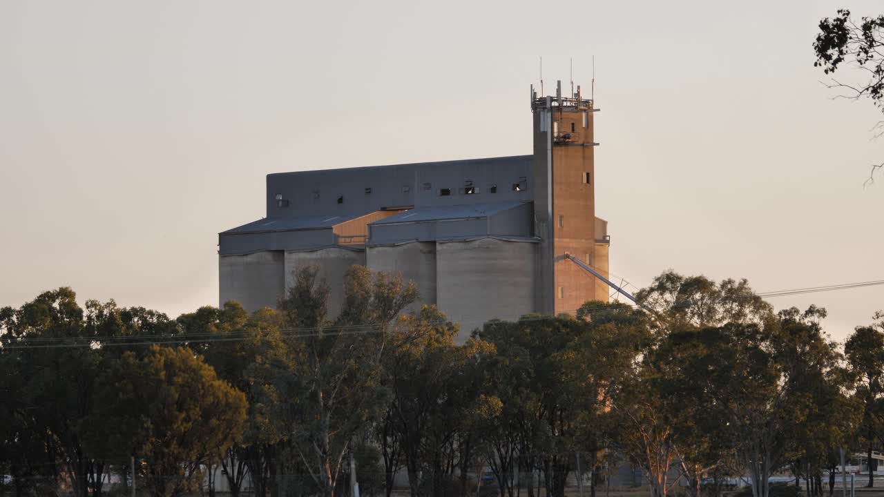 Grain silos viewed at sunrise in the small town of Miles, Queensland, Australia