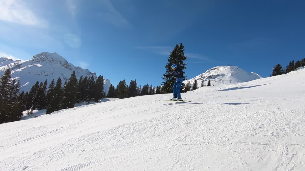 skier jumping over a ramp on the ski slope in Lech am Arlberg, Vorarlberg, Austria