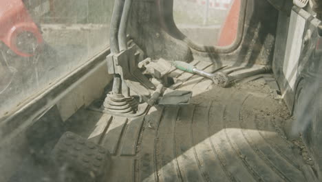 looking into the cockpit of a small mini excavator