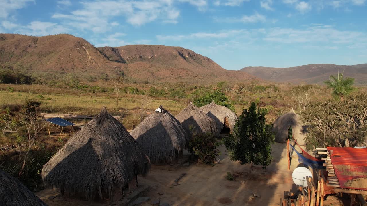 aerial view village in Chapada dos Veadeiros &amp;quot;Aldeia Macaco&amp;quot; hollow-shaped bioconstruction houses cerrado landscape Goi&aacute;s Brazil