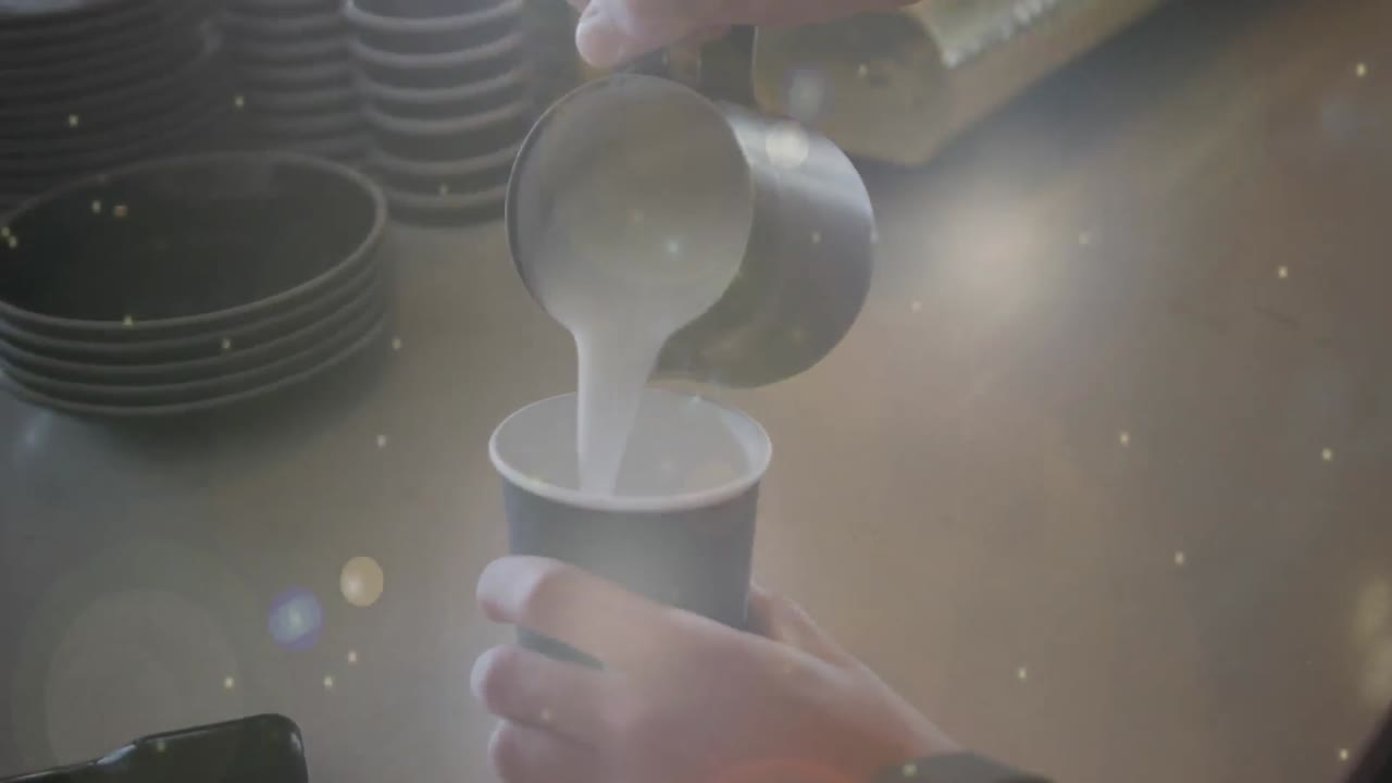카페에서 커피를 만드는 사람 위에 빛의 반점의 애니메이션