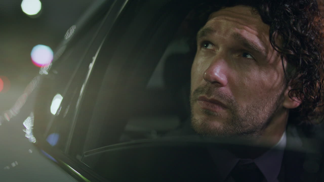 Businessman Talking on Phone, Hanging Up and Looking out Car Window