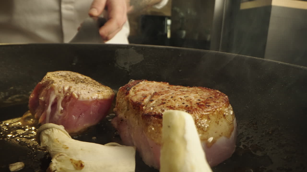 Steak and mushrooms being cooked