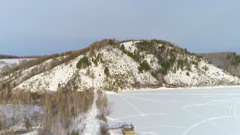 aerial view of a snowy mountain landscape in winter