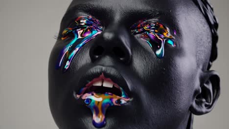 metallic colors streaming from eyes and mouth, revealing dramatic artistic portrait expressing surreal human emotion with futuristic visual intensity against shadowy backdrop