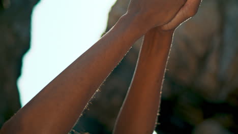 Closeup-hands-yogi-woman-raising-up-to-sunny-sky.-Unknown-girl-practicing-yoga.