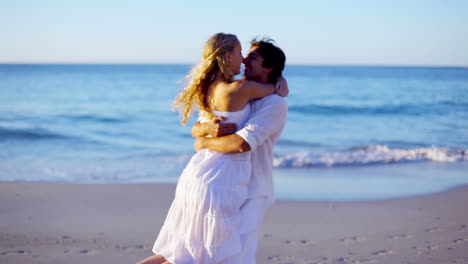 Man-catching-his-girlfriend-and-starts-turning-around-while-holding-her