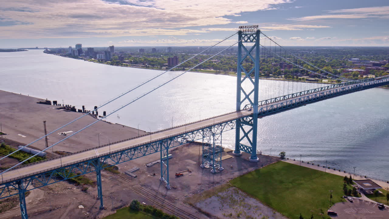 Aerial drone shot in cinematic style flying around the U.S.–Canada international bridge