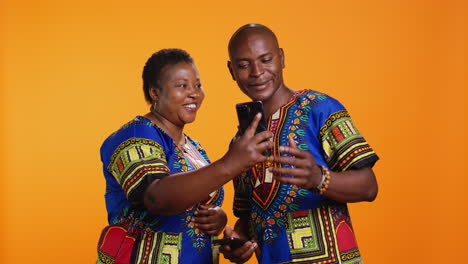 african american couple checking social media network