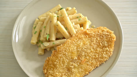 homemade quadrotto penne pasta white cream sauce with fried fish