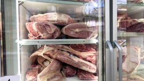 various cuts of meat showcased in a cooler