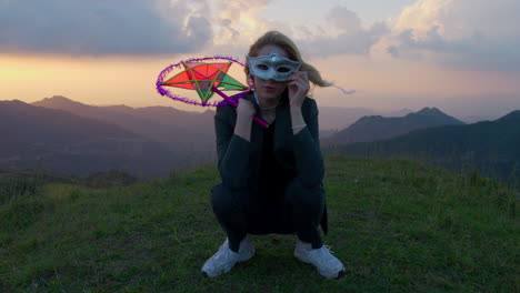 slow motion shot of a woman posing with a halloween mask and a star lantern