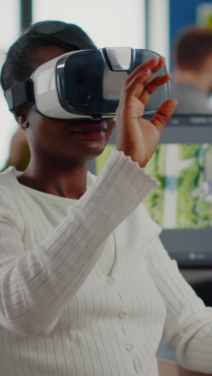 Vertical video Black videographer wearing VR headset editing project