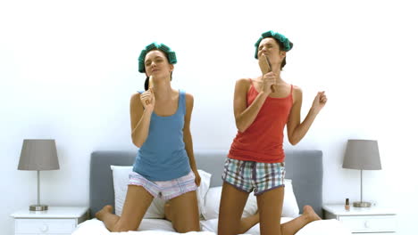 friends using hairbrushes as microphones