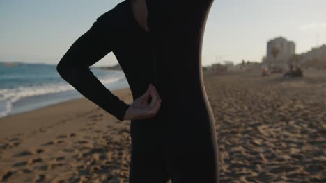 surfer man walking to the beach at sunset preparing for surfing training and search for waves in barcelona, spain, water, ocean exercise in sea with board, athletic male holiday or travel in vacation