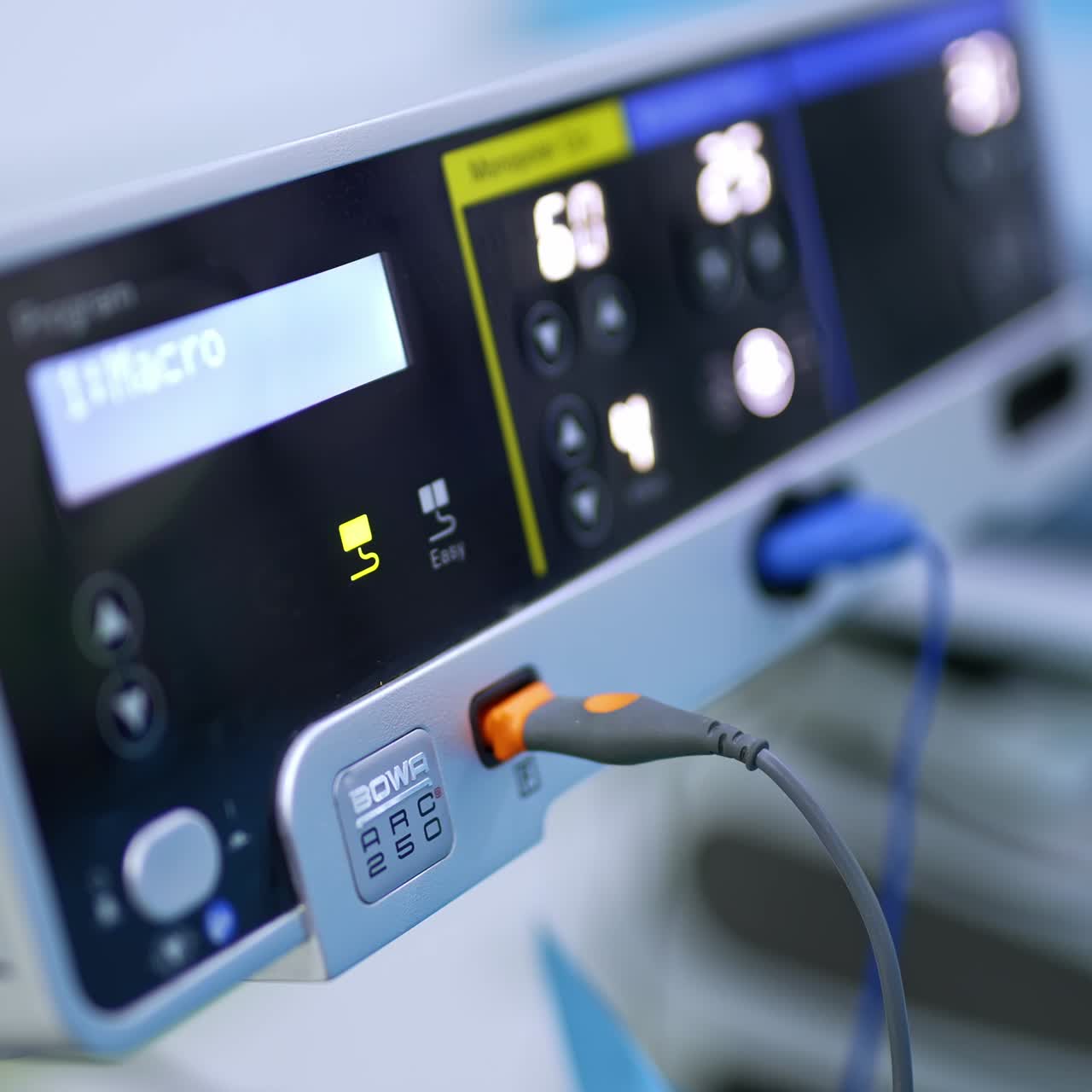 Switched on apparatus with light numbers and parameters. Working equipment in modern surgery room. Close up. Blurred backdrop
