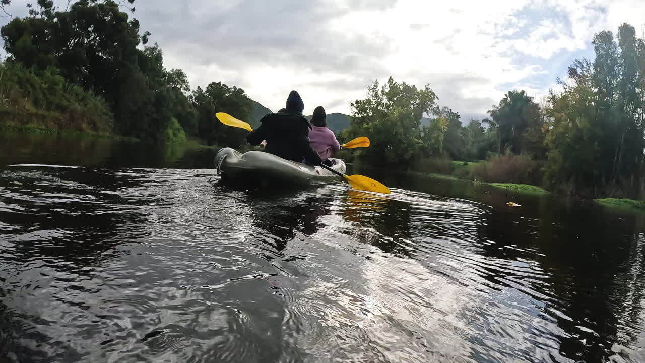 Kayak, travel and people on a boat in the lake
