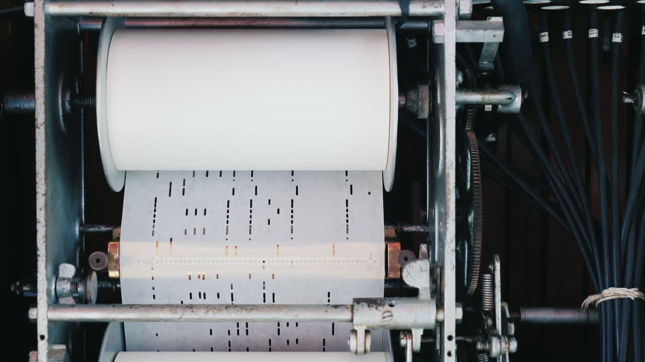 An Ancient Jukebox Mechanism Where The Melody Is Programmed On A Paper Punch Card