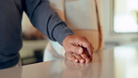 closeup of couple, man and woman holding hands