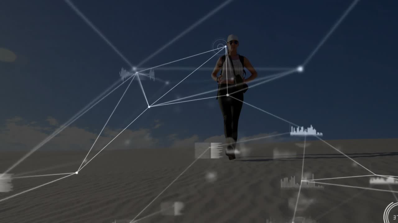 Woman hiker descending dune initiating technology HUD overlay with network charts tracking movement
