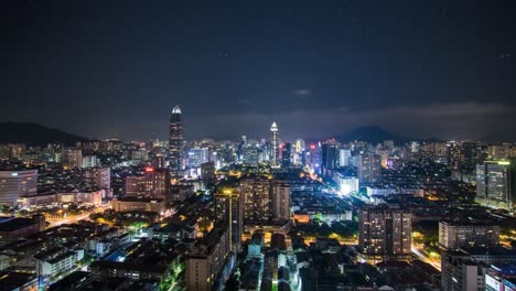 Bright city skyline at night features skyscrapers and cityscape, highlighting the lively atmosphere and architectural beauty. A bustling urban environment comes alive under the stars.