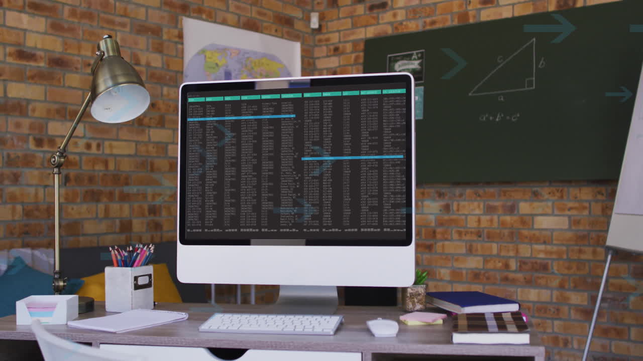 Displaying animation on computer screen in home office with brick wall