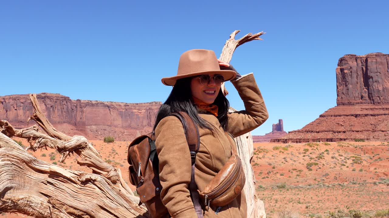 Happy Woman Traveler Posing in Scenic Monument Valley Desert Landscape