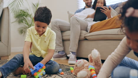 family, play or children on carpet with toys