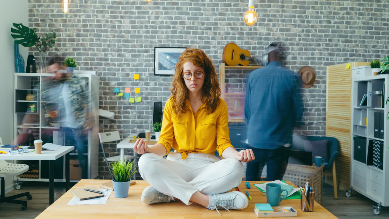 Woman Meditating in Busy Office