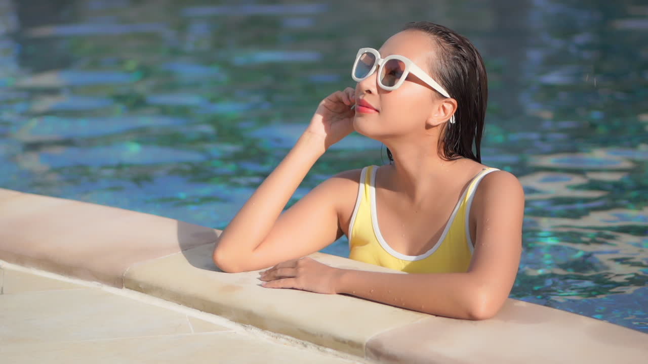 Living the asian dream lifestyle swimsuit at pool