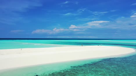 paradise exotic white sandy beach bend surrounded by calm clear water of turquoise lagoon with coral reef in maldives