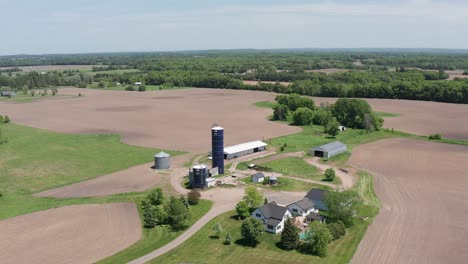 close-up panning aerial shot of a modern midwestern farm in minnesota