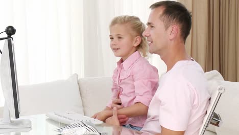 dad and daughter having a conference call