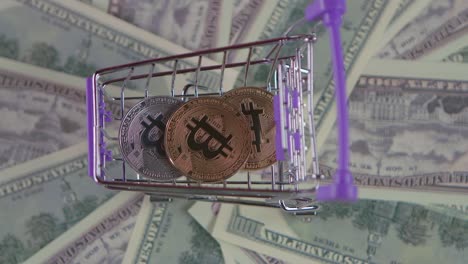 Bitcoin in a shopping cart on US dollar bills
